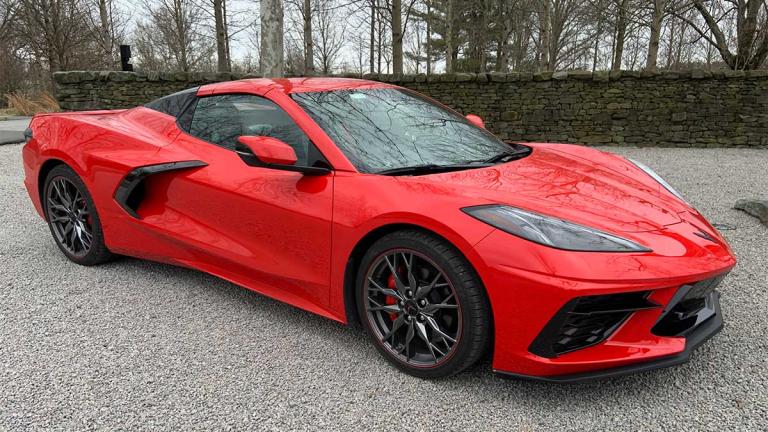 2024 Chevrolet Corvette Stingray in red parked outside.